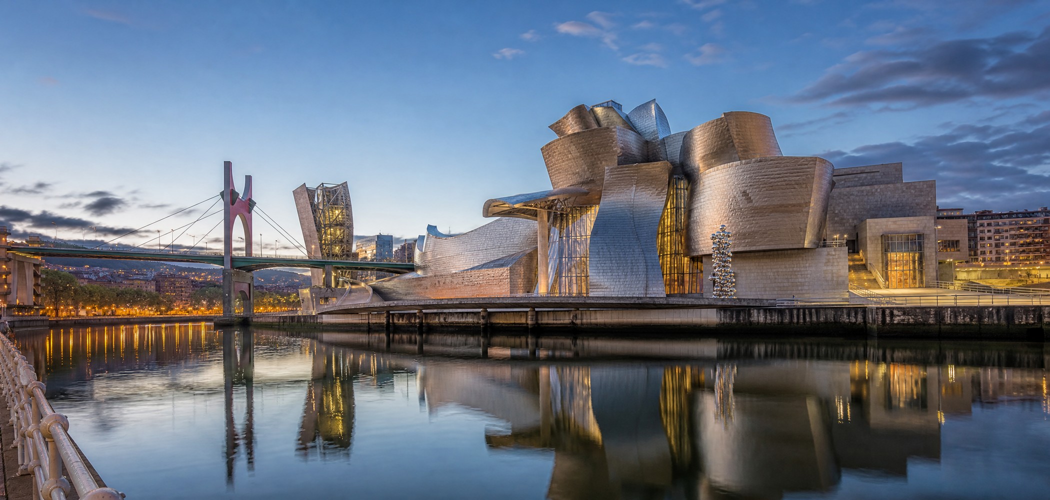 Guggenheim Museum Bilbao reflected in the Nervión River.