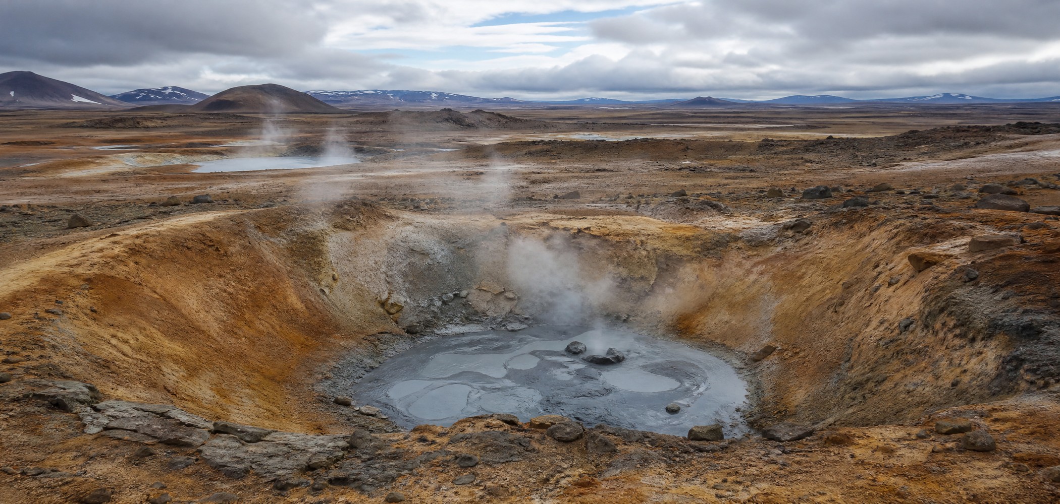 Volcanic geothermal basin with steam in Iceland’s Lake Mývatn region.