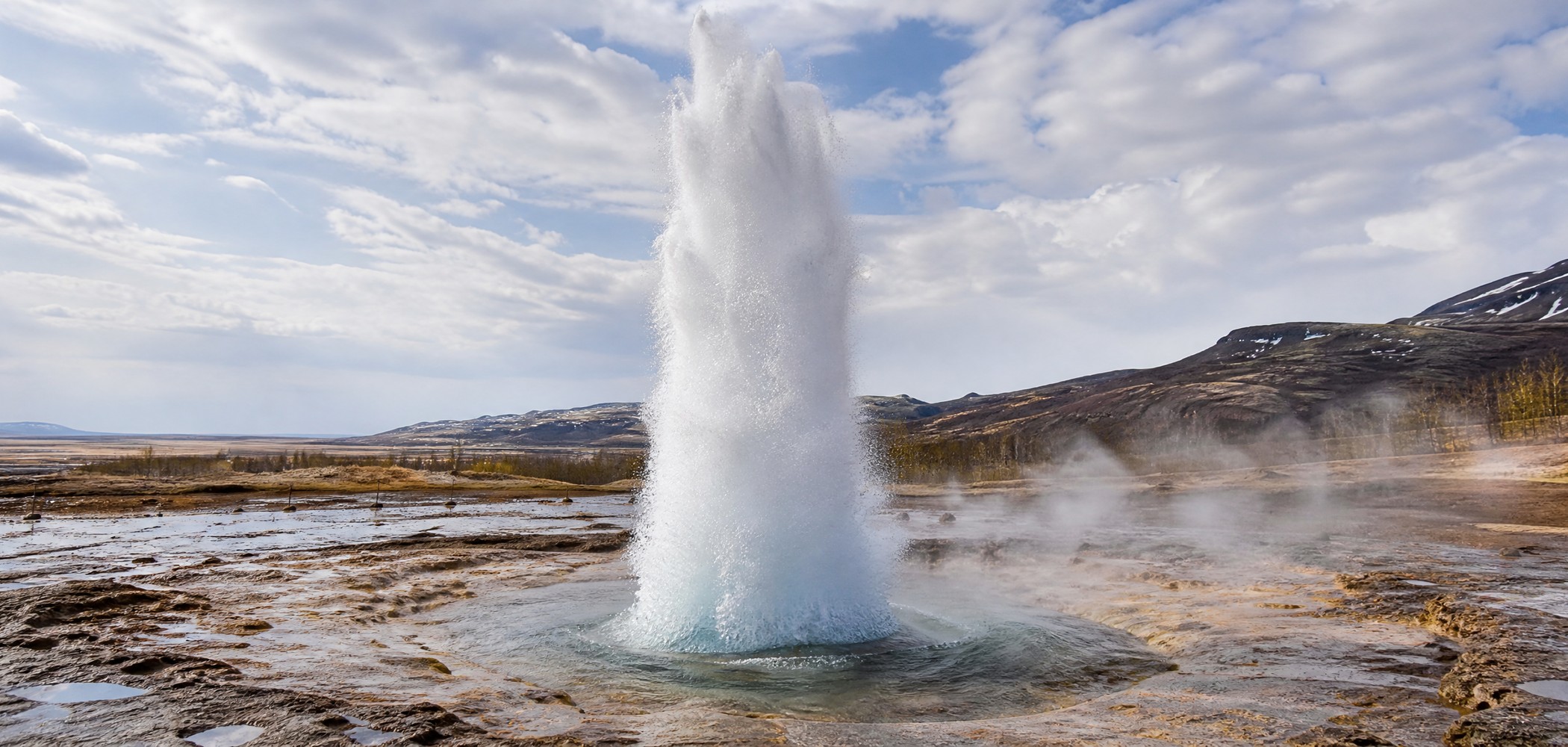 Strokkur geyser erupting in Iceland’s Golden Circle geothermal area.