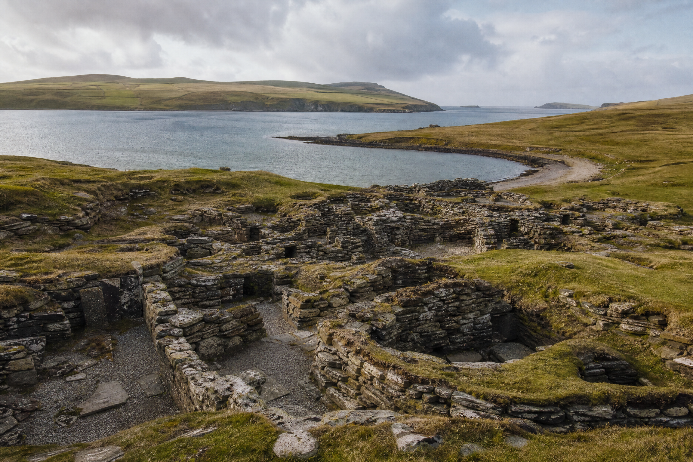Wide view of the Jarlshof archaeological ruins above the West Voe of Sumburgh, Shetland