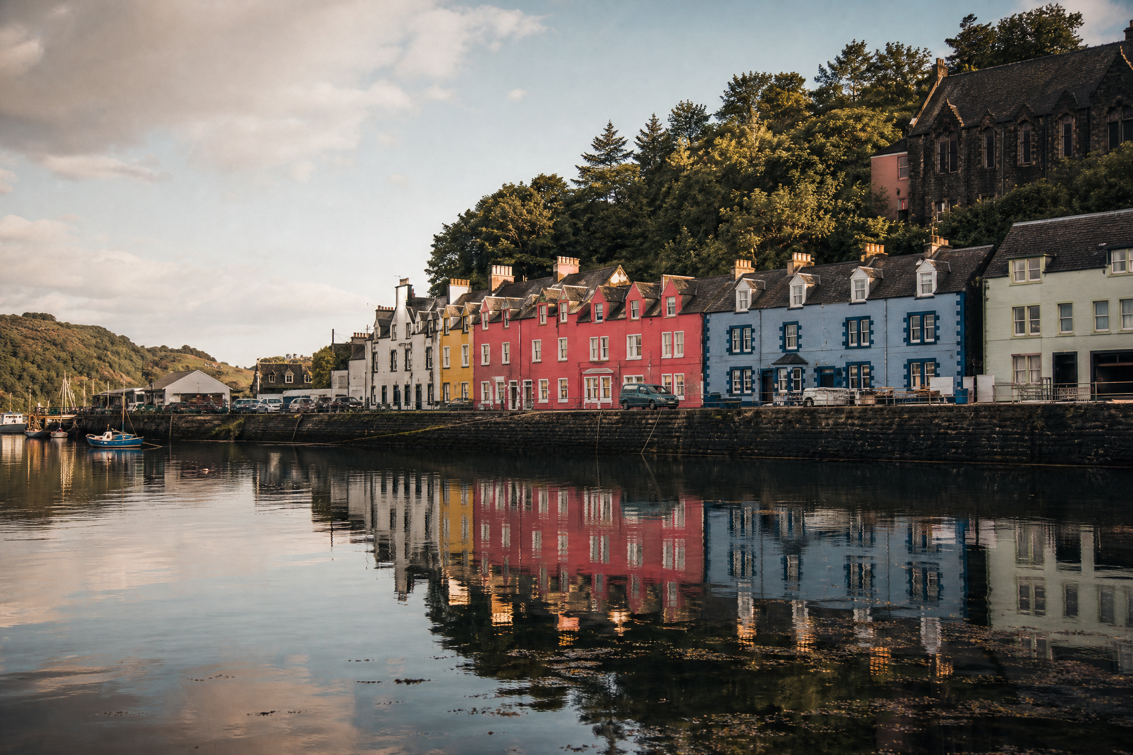 Tobermory harbour on the Isle of Mull, Scotland, with colourful painted buildings reflected in the water