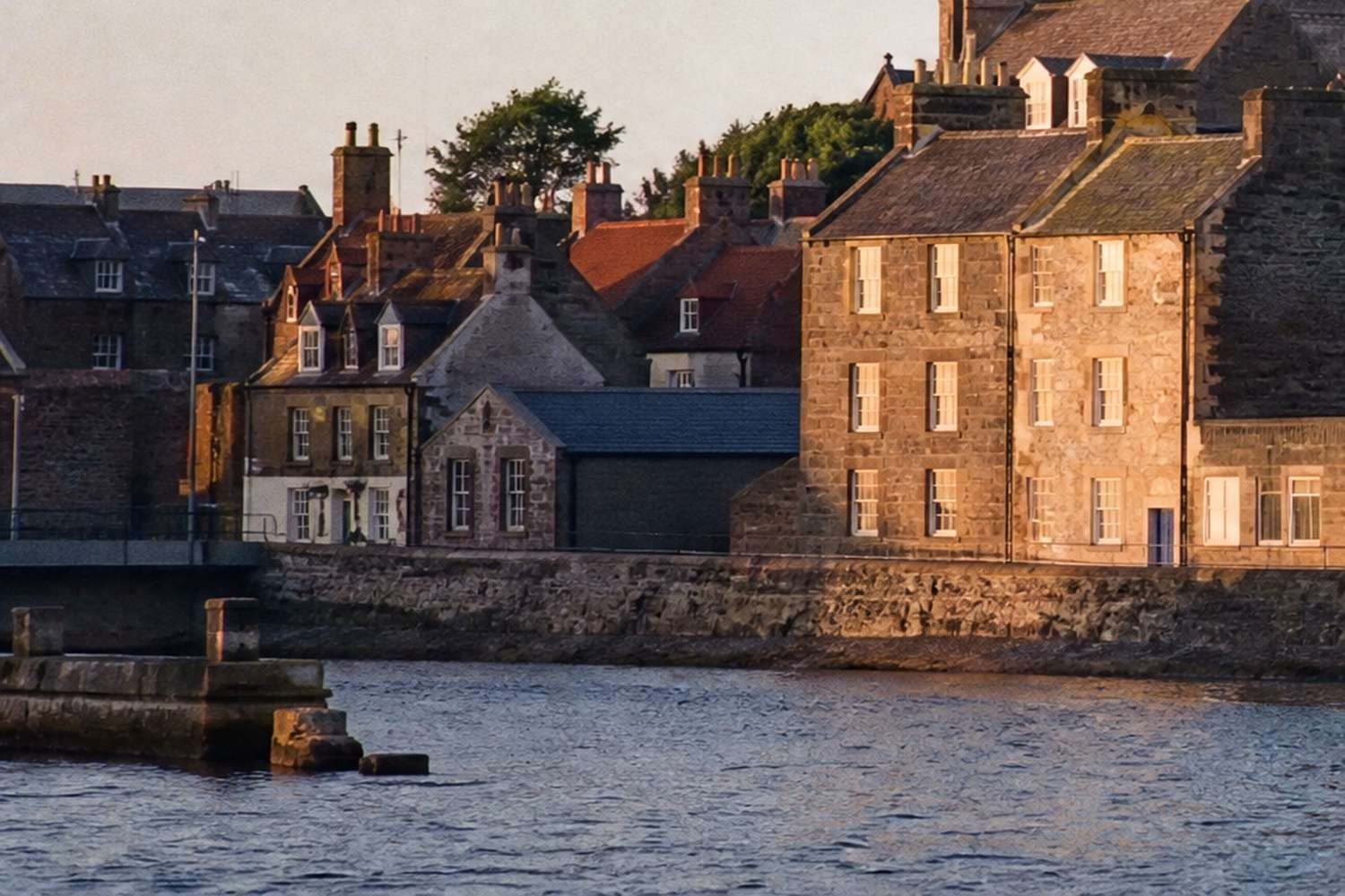 Kirkwall harbour waterfront and historic stone pier, Orkney, Scotland