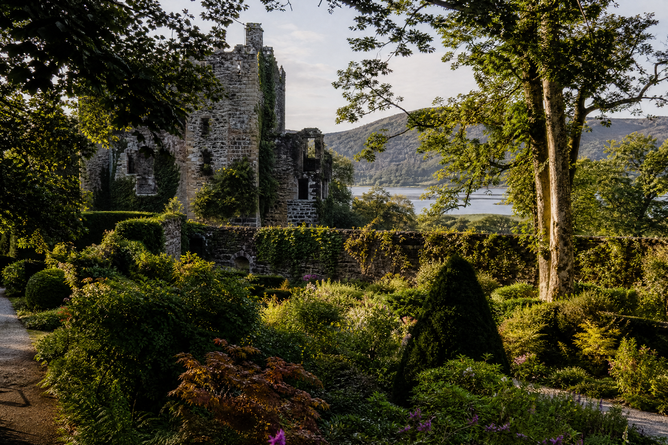 Armadale Castle ruins framed by walled gardens, with a view of the Sound of Sleat, Isle of Skye