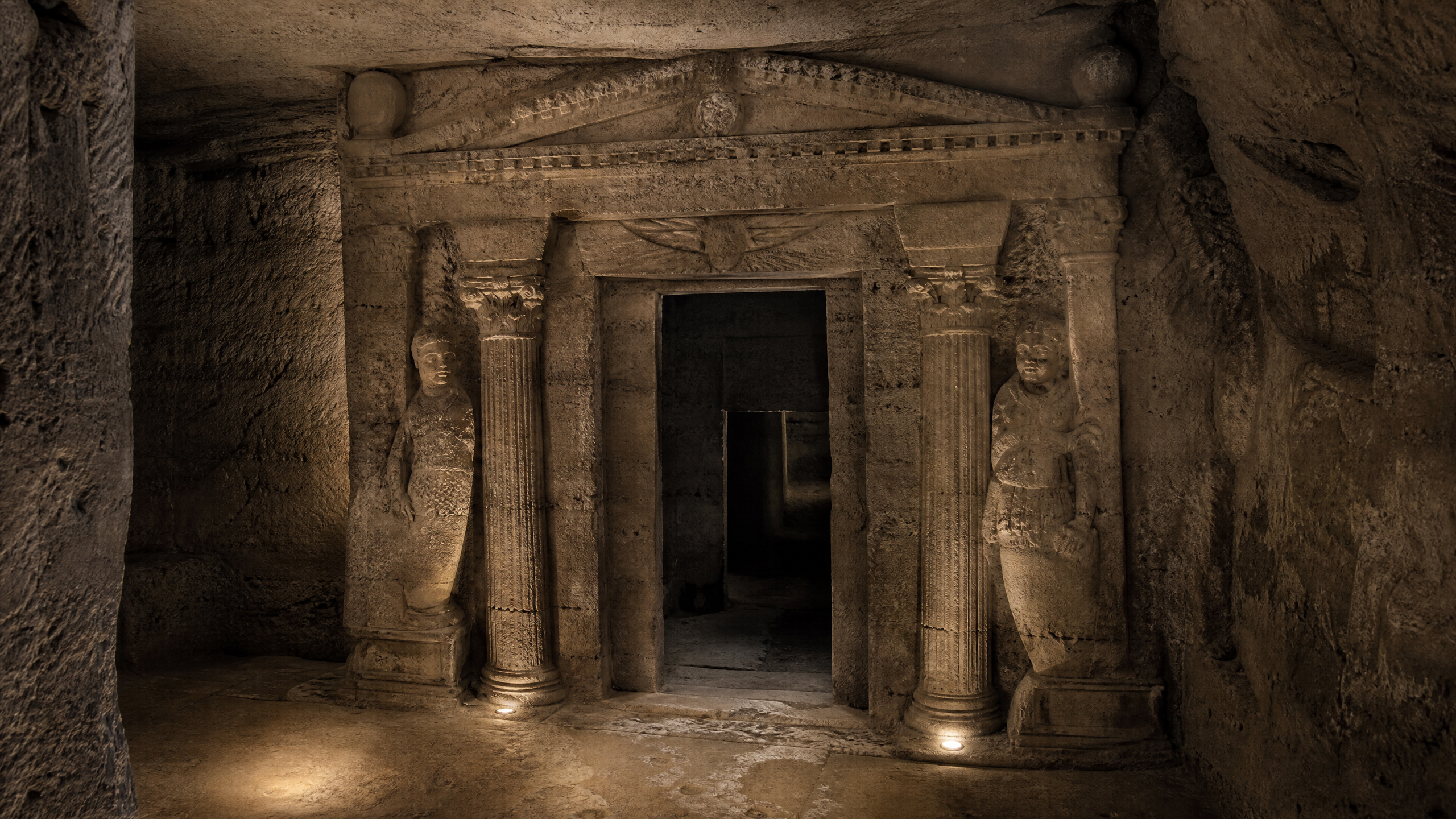 Principal tomb façade at the Catacombs of Kom el Shoqafa, Alexandria, combining Egyptian funerary form with Greek architectural detailing