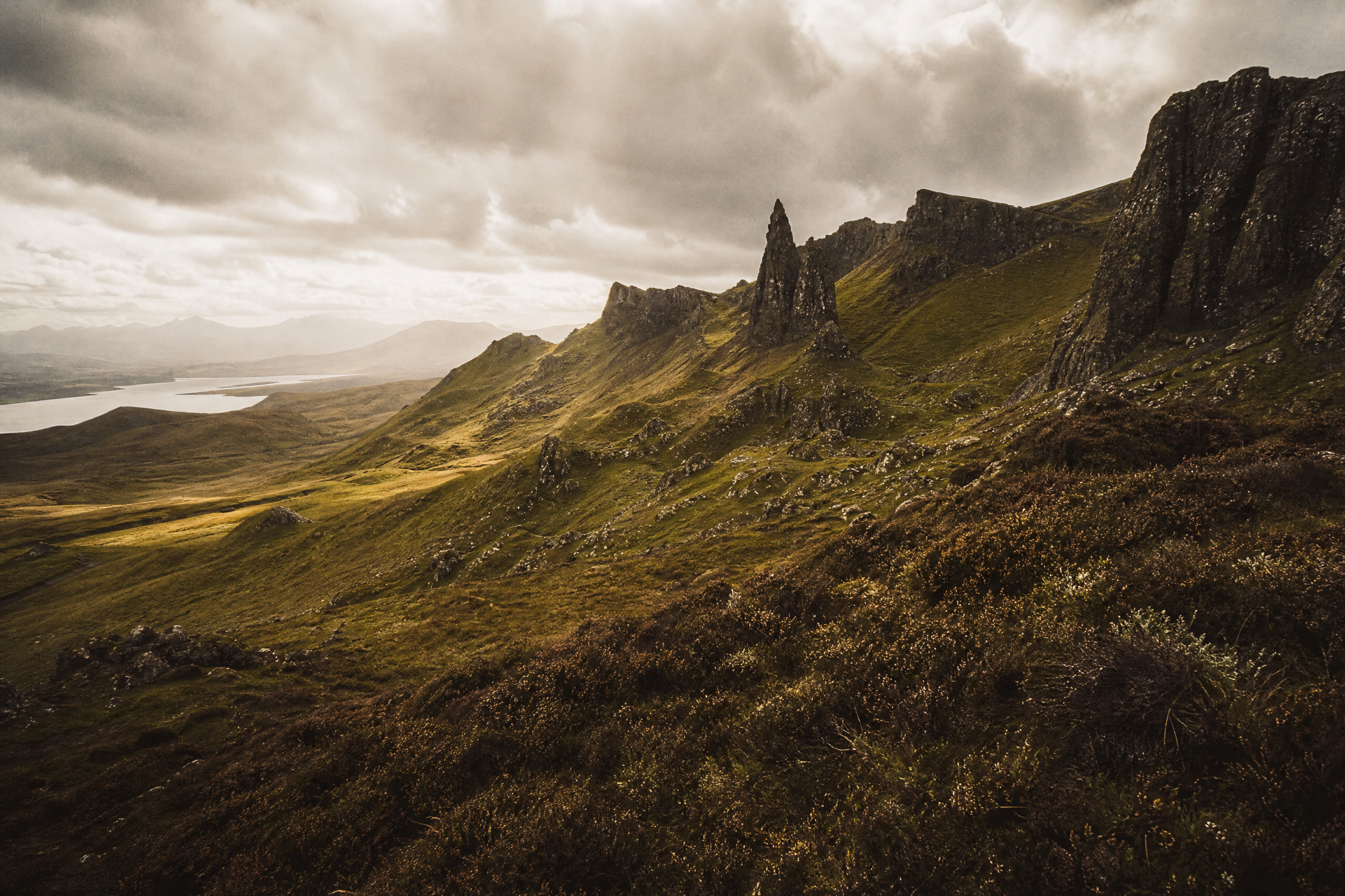 Trotternish ridge on the Isle of Skye, volcanic pinnacles above a green glen, Scotland