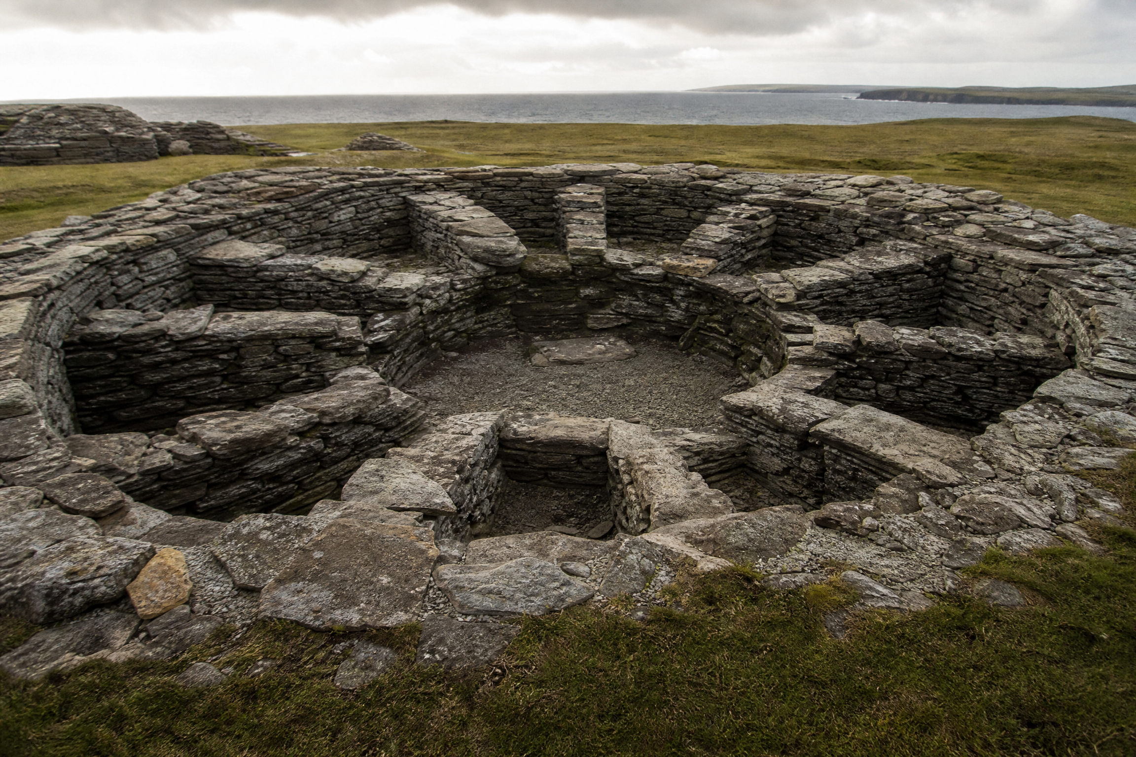 Iron Age wheelhouse at Jarlshof, Shetland, showing radial internal stone piers dividing the interior into cells