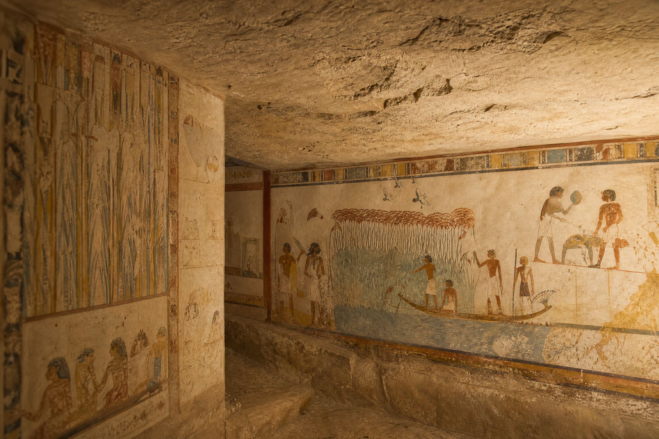 Vividly painted artisan tomb interior at Deir el-Medina showing a Field of Reeds afterlife scene, Luxor, Egypt
