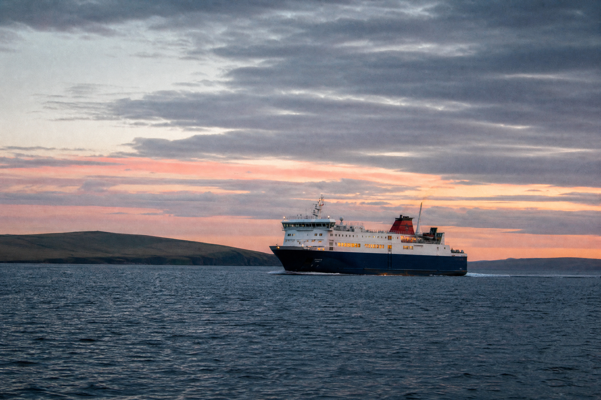 NorthLink ferry crossing beneath a dramatic North Atlantic sky at dusk